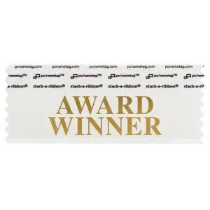white badge ribbon with award winner in gold lettering