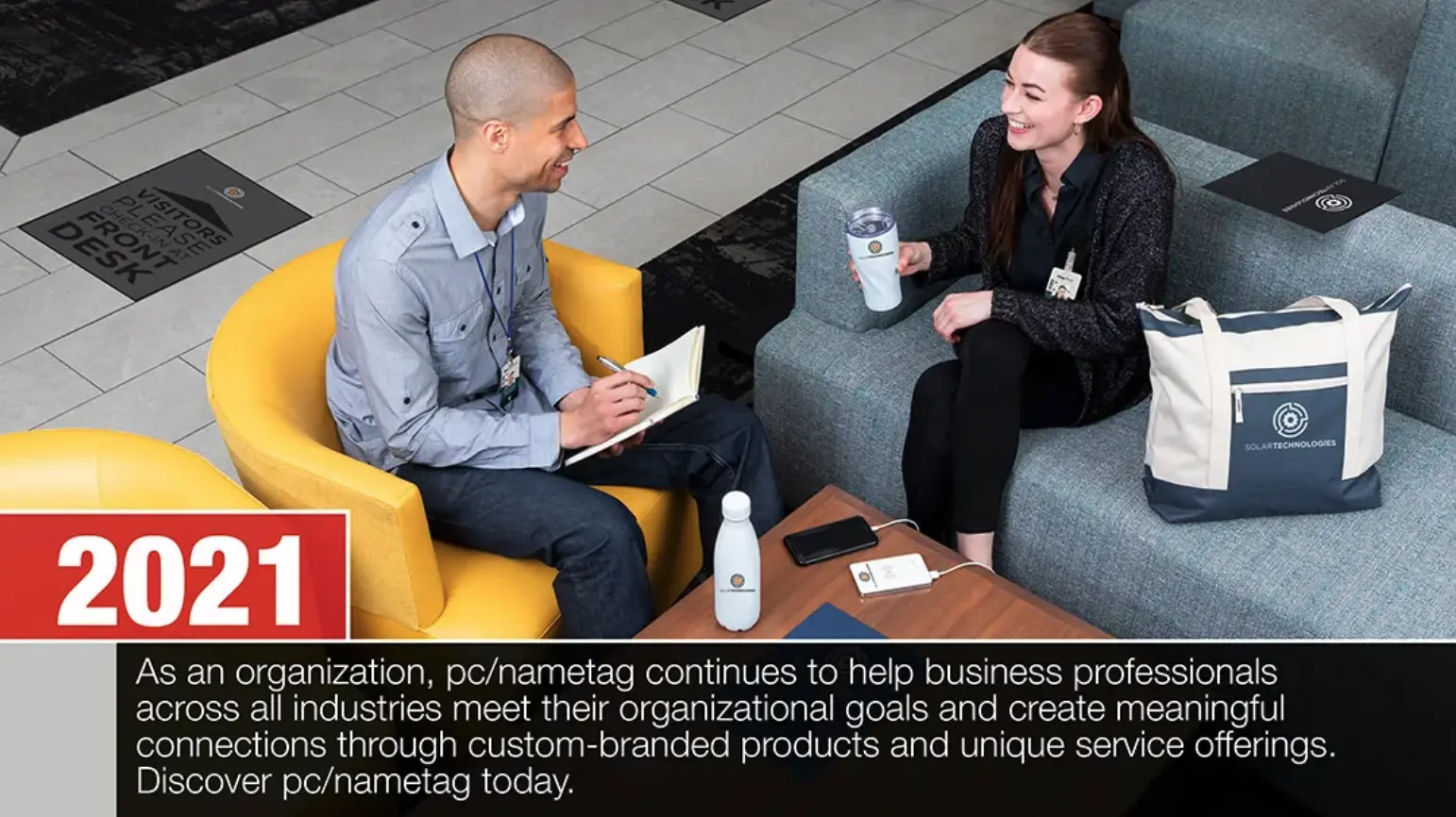 2021: Two professionals meeting in a modern lobby