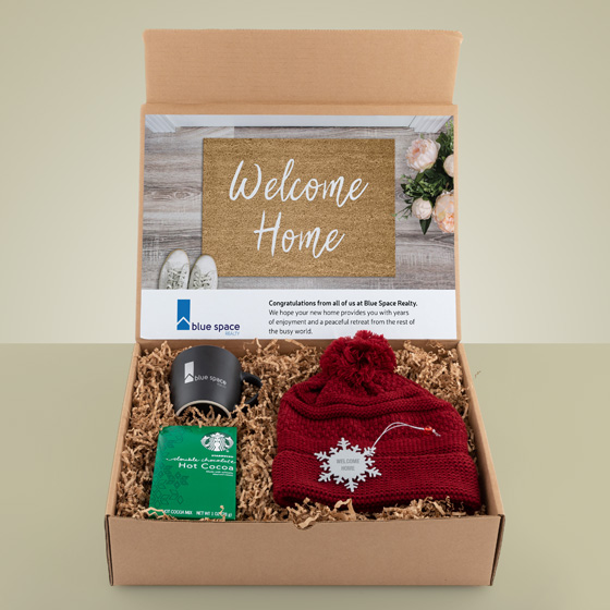 Gift box for realtor with hat, coffee cup and hot cocoa mix
